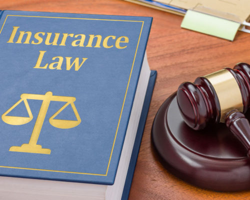 38365668 - a law book with a gavel - insurance law